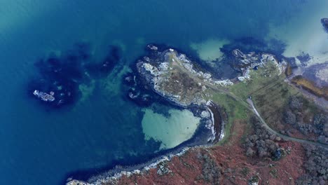 aerial - turquoise waters, isle of gigha, kintyre, scotland, rising top down view