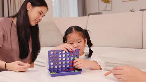 a family enjoys playing a board game together in a cozy living room, fostering connection and joy