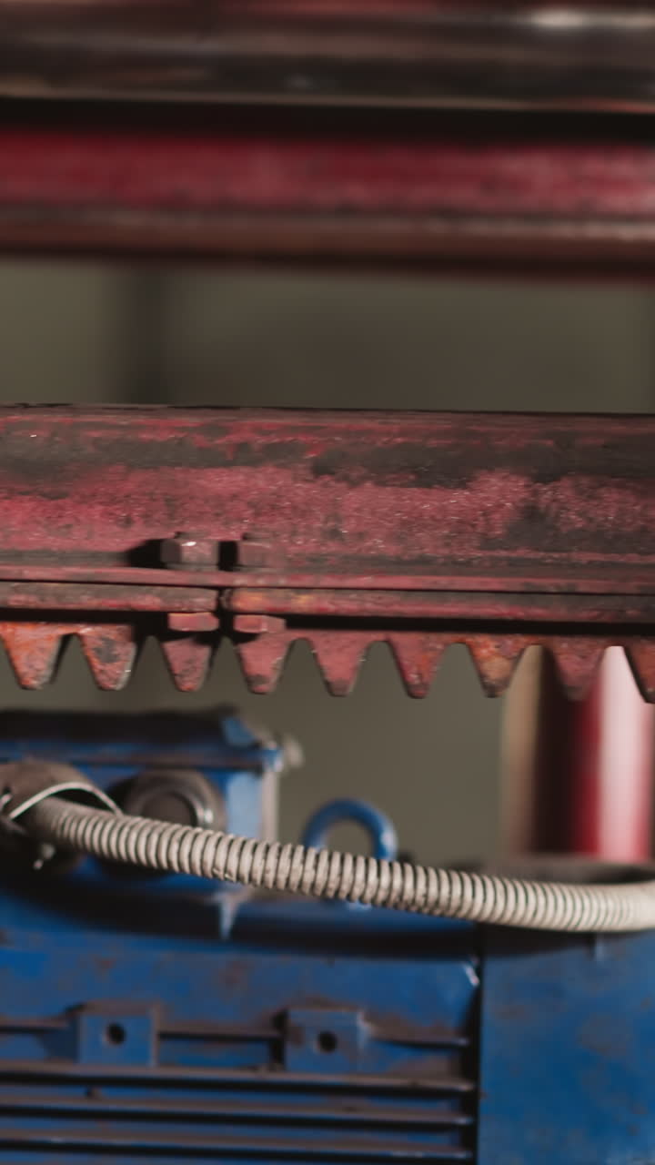 Vacuum lifting system with air pump in plant workshop closeup. Heavy loads transporting equipment in manufacturing shop. Automatic machine tool