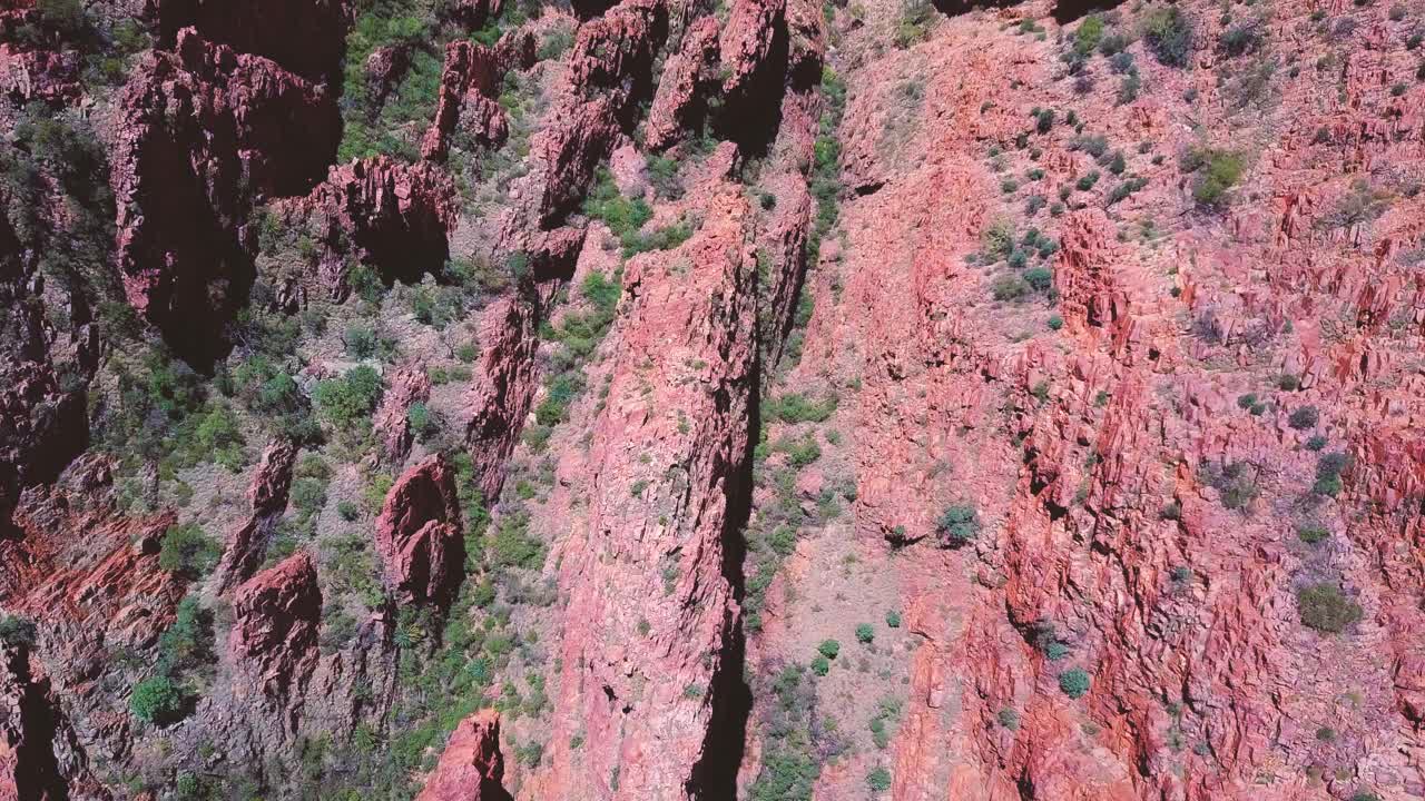 Mt Sonder - Central Australia. Top down aerial flyover - tracking forwards - cliffs, ravines and gorges. Filmed on DJI Mavic Pro.