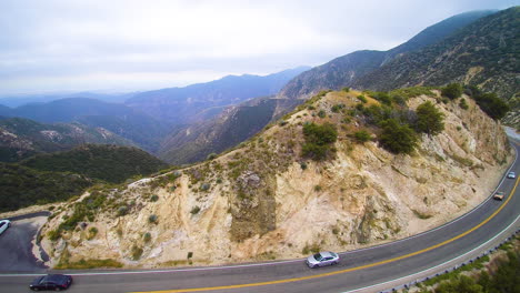 drone footage road in angeles national forest with cars southern california