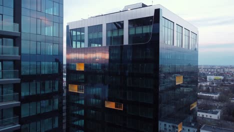 Aerial-View-Of-Glass-Buildings-At-Sunset