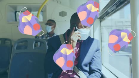 Animation-of-face-masks-over-african-american-man-in-face-mask-in-bus-with-smartphone