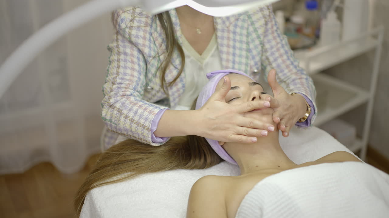 Woman Receiving a Professional Facial Skincare Treatment