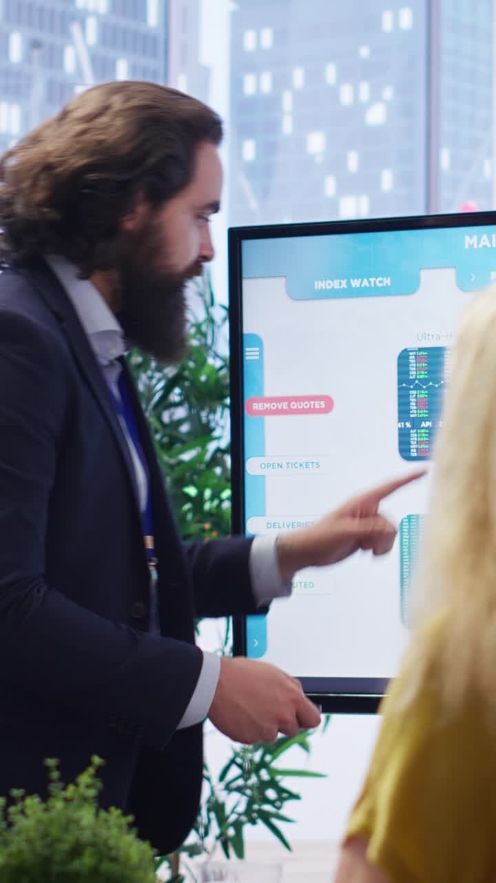 Vertical video Financial advisor presents detailed stock market analysis to clients