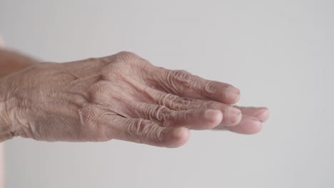 close-up of an elderly person's hand with wrinkles