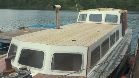 establishing shot of above deck sanded wooden roof liveaboard boat