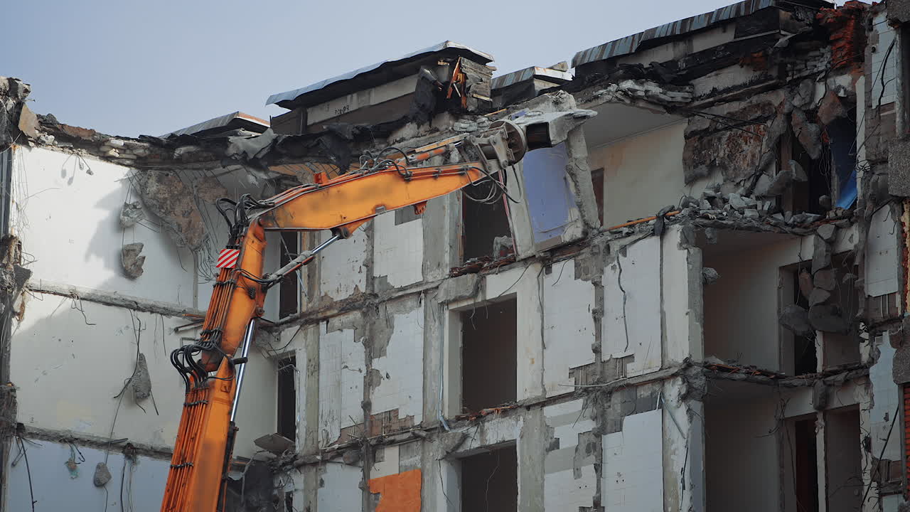 Urban excavator destruction demolishing. Demolition building after nature disease.