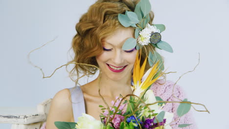 portrait of a young woman holding flowers in her hair