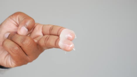 hand applying cream or lotion.