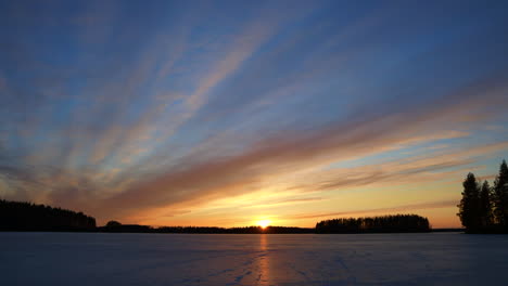 timelapse of spectacular sunset on an icy lake with changing stunning colors