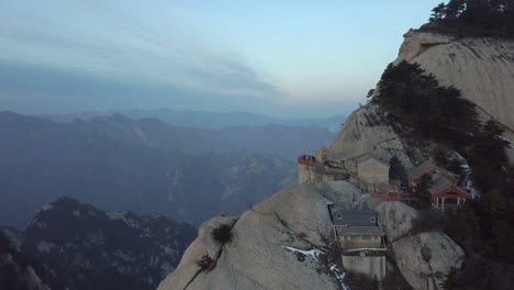 aerial flies past dramatic viewpoint on granite huashan mountain china