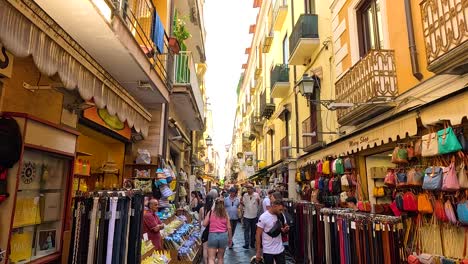 crowded street with shops and pedestrians