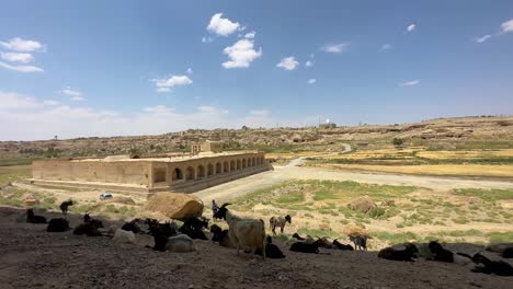 izadkhast caravansary in desert climate in iran the hospitality concept of traveler in silk road stay overnight in mud brick building rest stop hotel services nearby mud adobe ruins of settlement fars