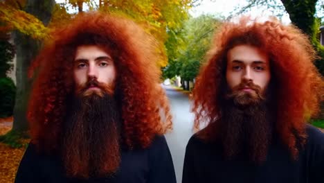 two men with long red hair and beards