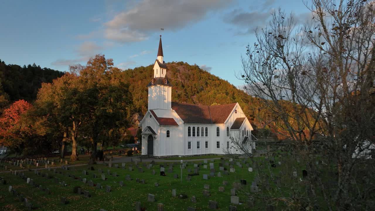 Beautiful autumn colors frame the traditional Norwegian church in Søgne