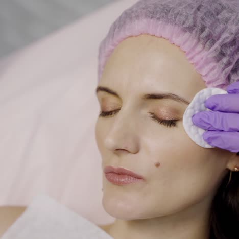 a cosmetologist injects botox shots into the wrinkle area of a beauty woman. prevention of crow's feet. modern cosmetology
