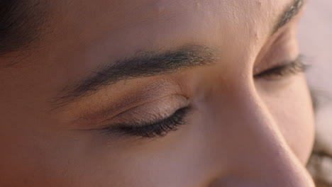 close up beautiful eyes hispanic woman looking at ocean view enjoying natural beauty contemplating future enjoying freedom