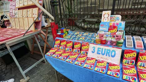 uno cards displayed at a naples street market