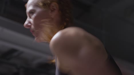 Close-Up-Studio-Shot-Of-Mature-Woman-Wearing-Gym-Fitness-Clothing-Doing-Cardio-Exercise-Running-On-The-Spot