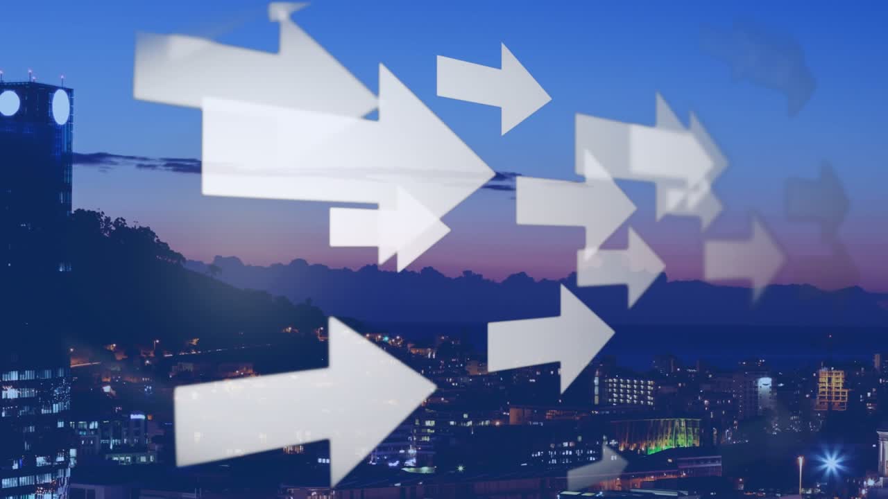 Sunset cityscape video with lit buildings and directional arrows on green screen
