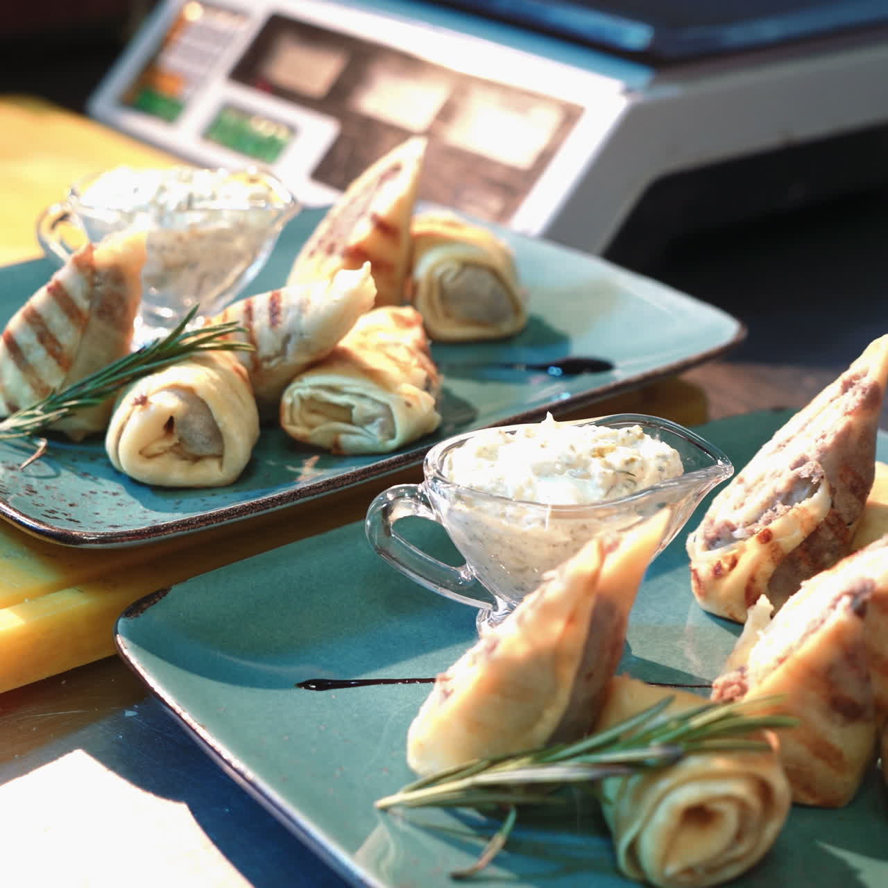 Professional chef garnishing a dish. Thin pancakes with fillings. Ready for service to the customer. Sqare video