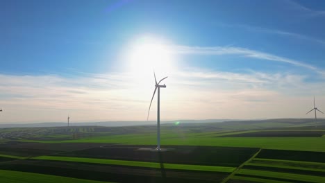 Wind-turbines-on-a-sunny-day-in-a-vast-green-field