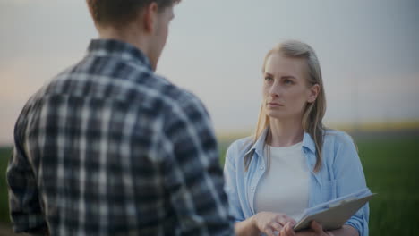 farmer explaining agronomist in farm