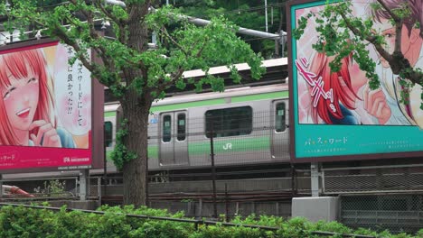 metro train passing by manga signboard in tokyo, 4k