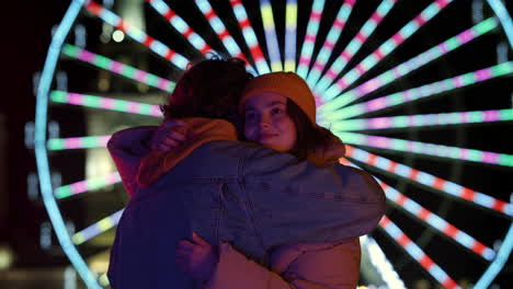 man and woman hugging in city center