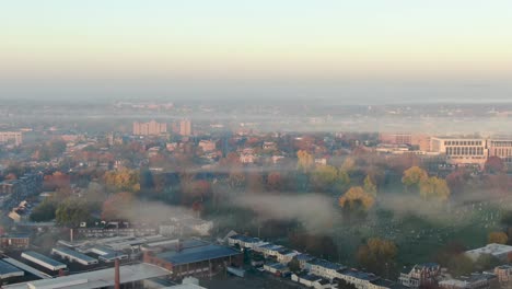 Dramatic-fog-clouds,-smoke-hangs-over-urban-city-setting