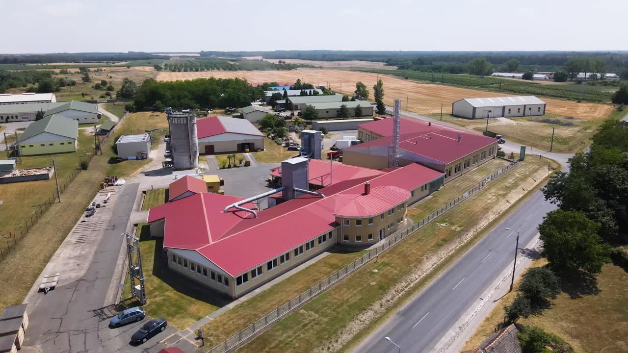 Aerial view of large industrial complex with buildings and silos in Nemesnadudvar, Hungary