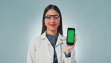 Science-woman,-phone-and-green-screen-in-studio