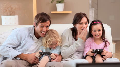 happy siblings playing video games