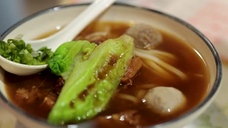 delicious soup with noodles and fresh ingredients