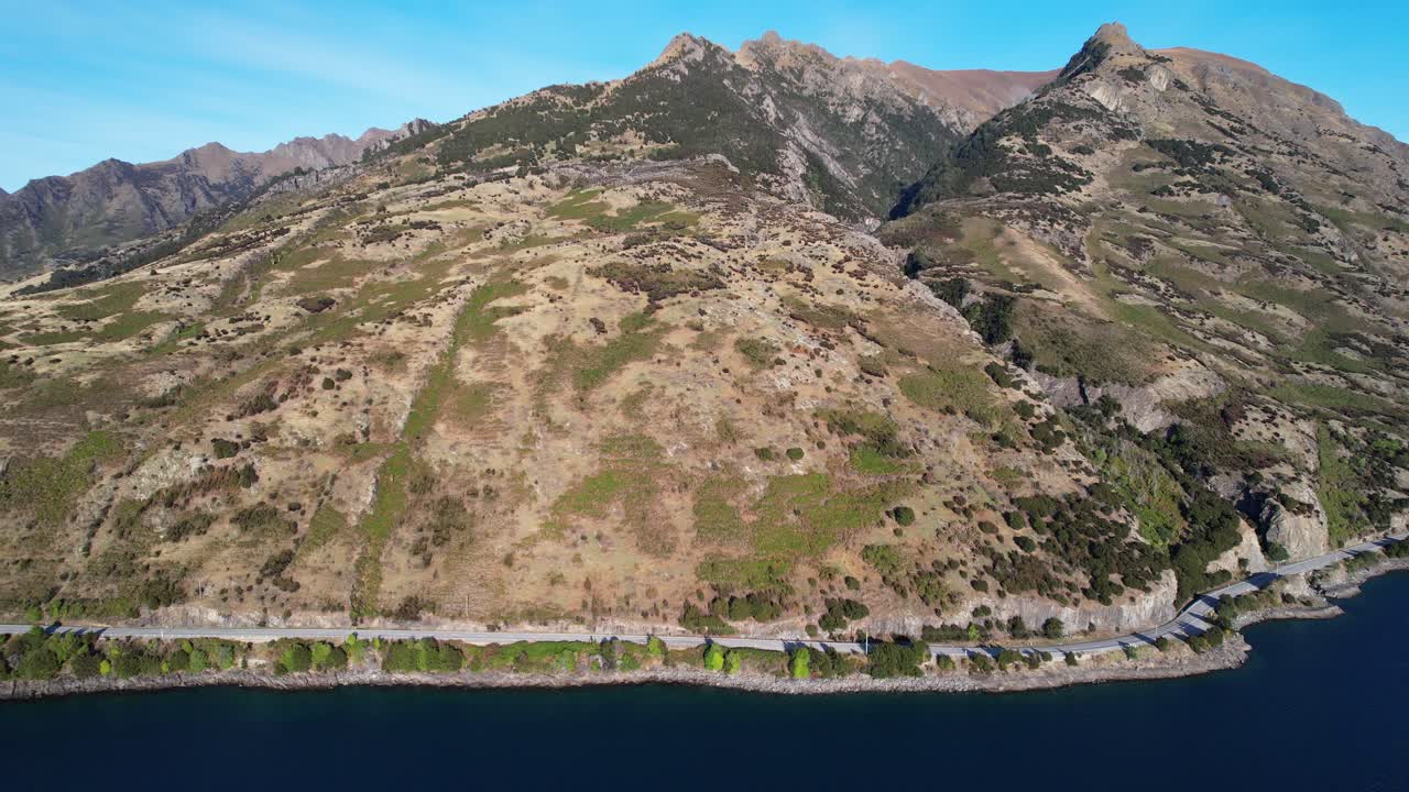 Mount Burke And Lake Hawea At Daytime In South Island, New Zealand - Aerial Pullback