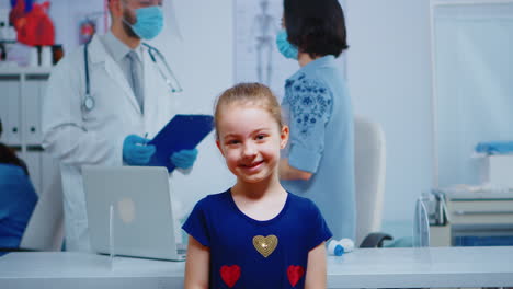portrait of little girl smiling in medical office