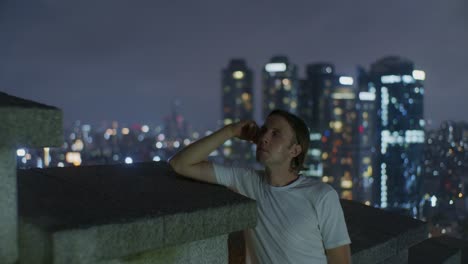european man male caucasian white model's face in the night on the top of the hill and wall with long hair