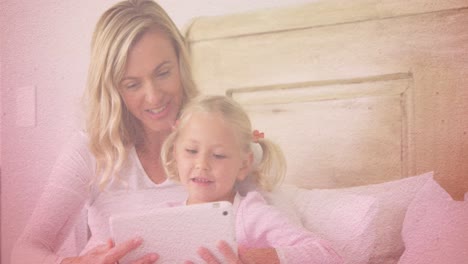 Animation-of-hearts-falling-over-caucasian-woman-and-her-daughter-using-tablet