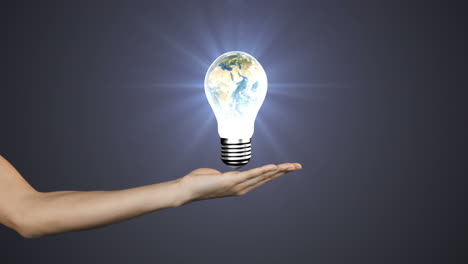 Hand-presenting-light-bulb-with-earth