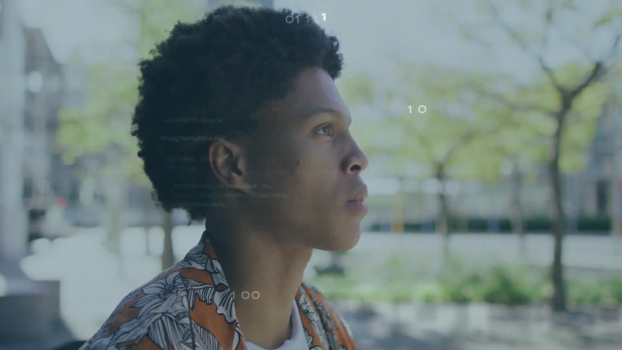 In school, animation with digital numbers overlaying scene of young man outdoors