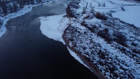 Drone-footage-of-snowy-mountains-and-houses-in-Calgary