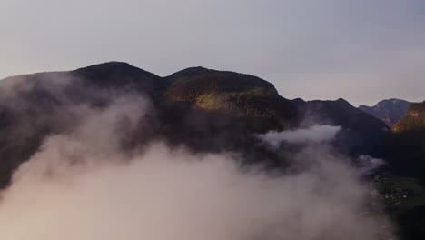 misty mountain peaks at sunrise/sunset