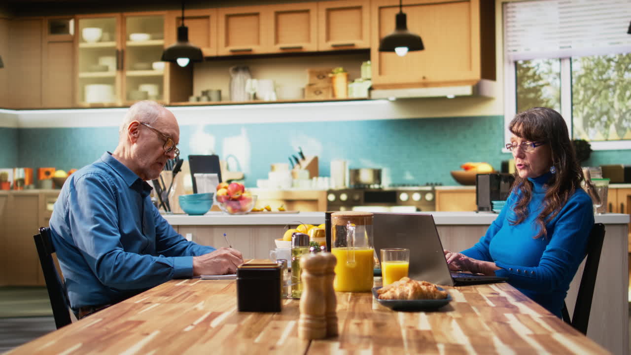 Elderly man making a list for grocery shopping and other home essentials