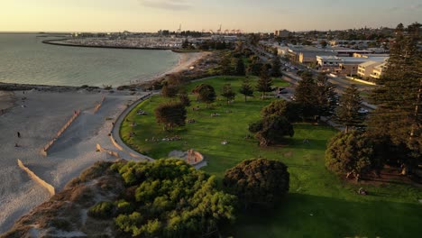 drone flight at sunset over south beach park in fremantle, western australia