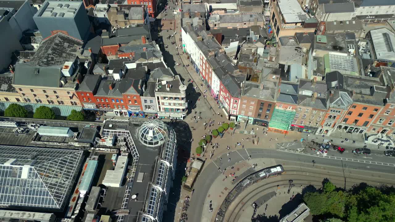 Reversing aerial video of the Luas Tram System operating in Dublin City Centre, County Leinster, Ireland, on a bright and sunny day. Filmed in 4K, 60FPS and with Rec709 color.