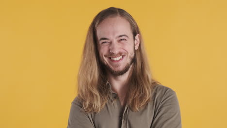 caucasian young man smiling at the camera.