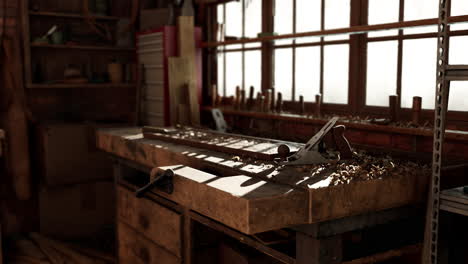 Retro-stylized-old-tools-on-wooden-table-in-a-joinery