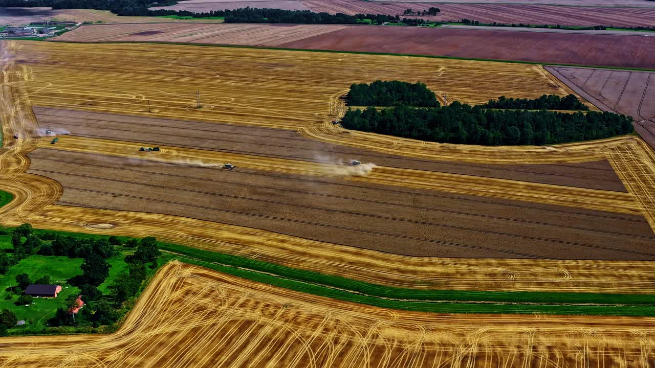 Overhead shot looking down on the golden fields during harvest in a time lapse