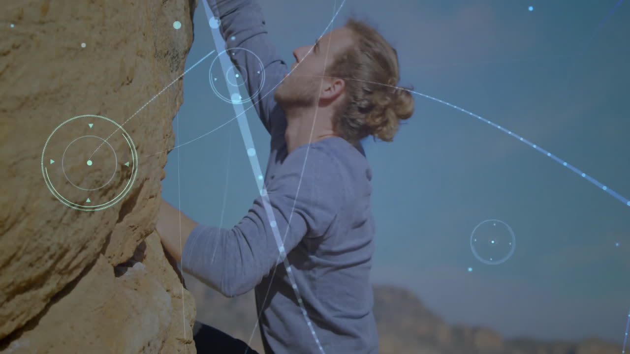 Man climbing rock face outdoors, displaying digital overlay charts for technology presentations